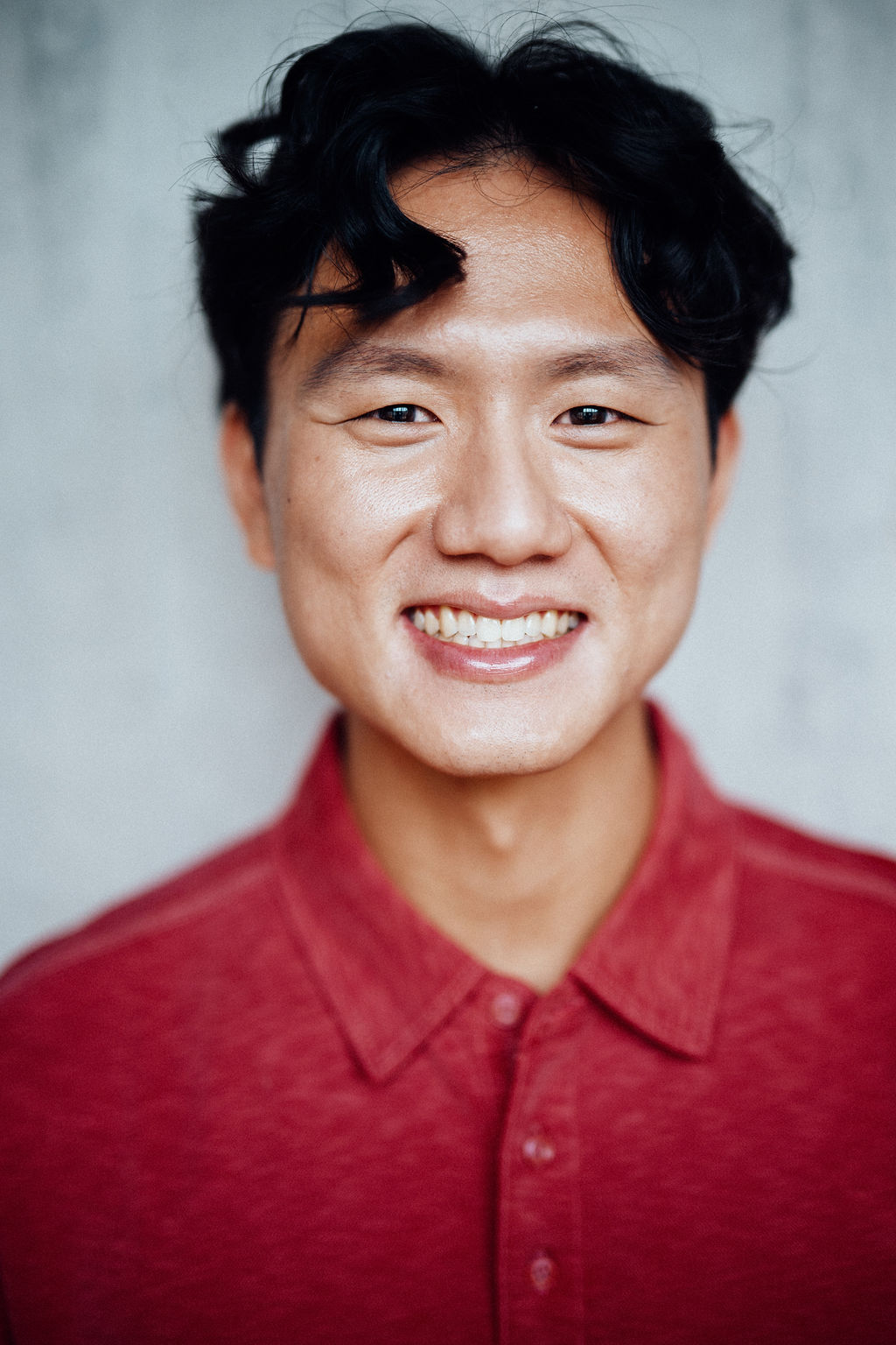 Sang Hun Kim headshot long hair